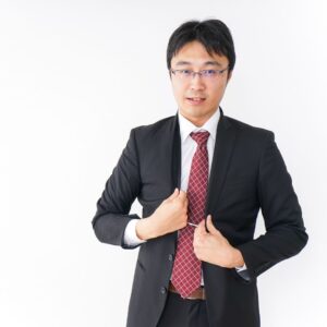 business man straightening his tie