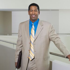 business person holding laptop